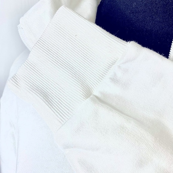 Puma full zip sweatshirt w/ shorter front,  longer back. Pockets. White & black. - Picture 8 of 11